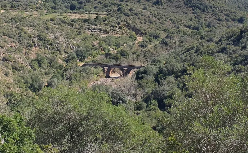 Roman bridge and footpath below Paderne Castle in the Quarteira valley